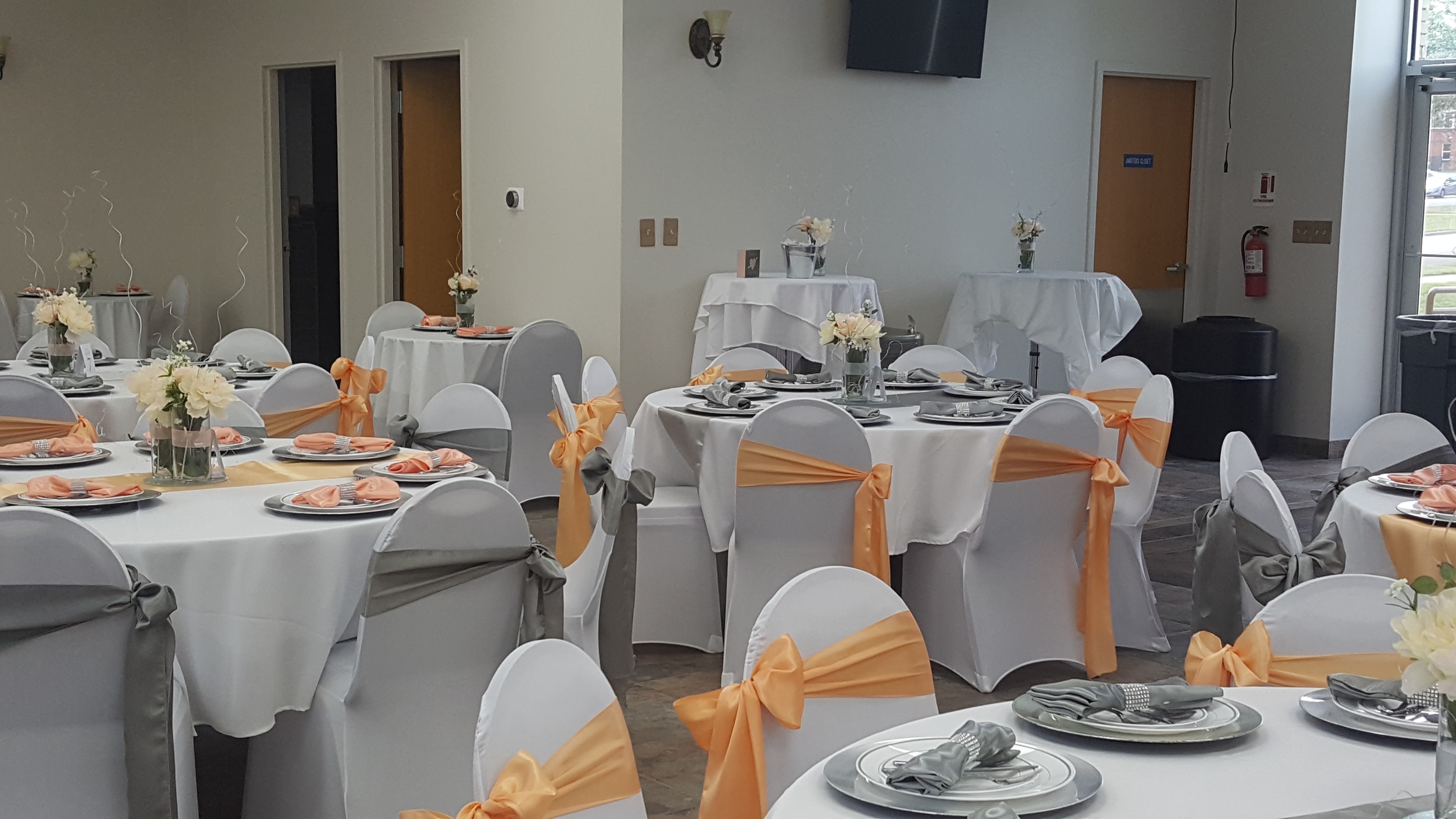 Peach and gray banquet hall reception setup at Deja Vu Event Space