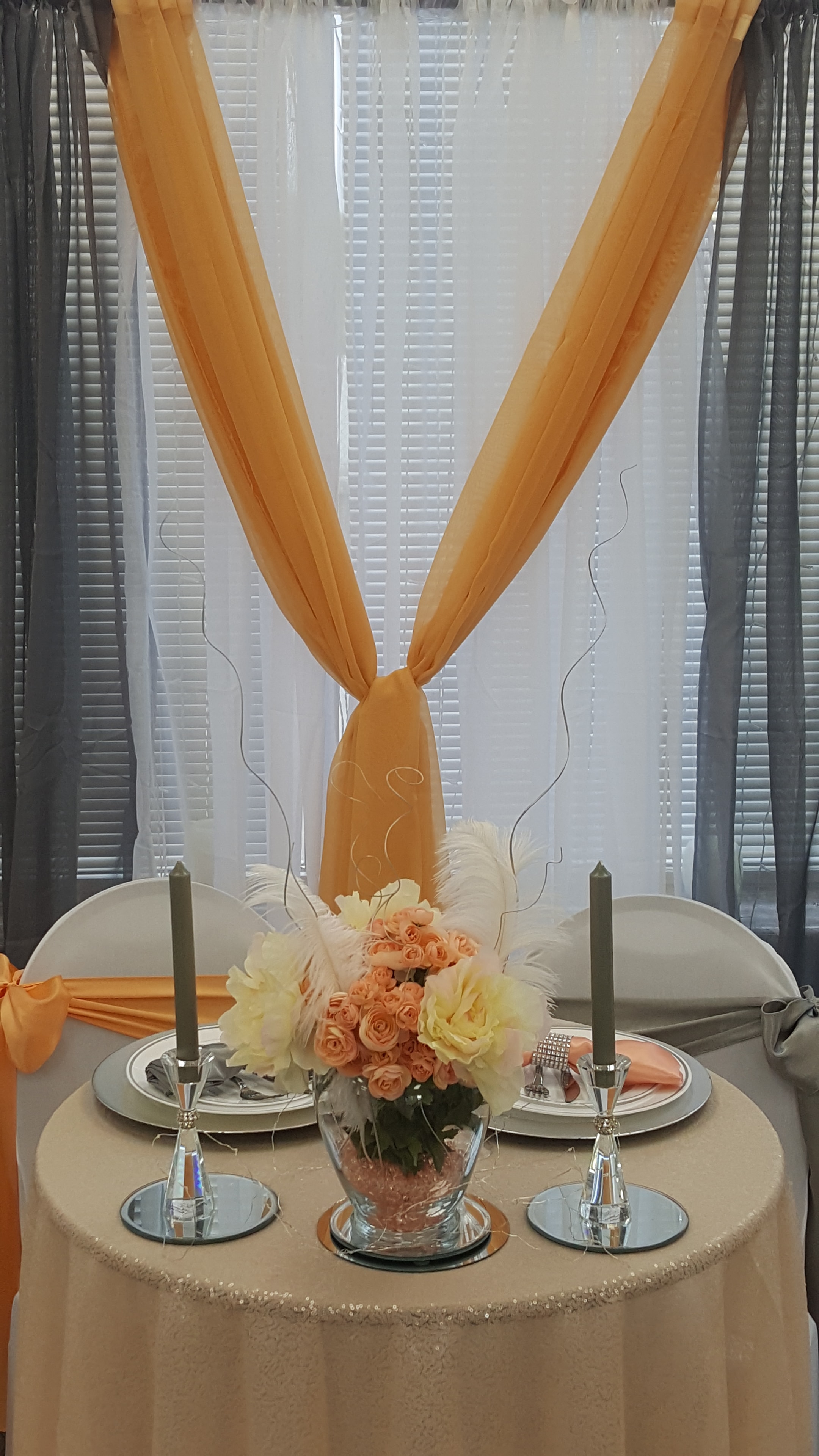Floral centerpiece and candle detail at Deja Vu Event Space
