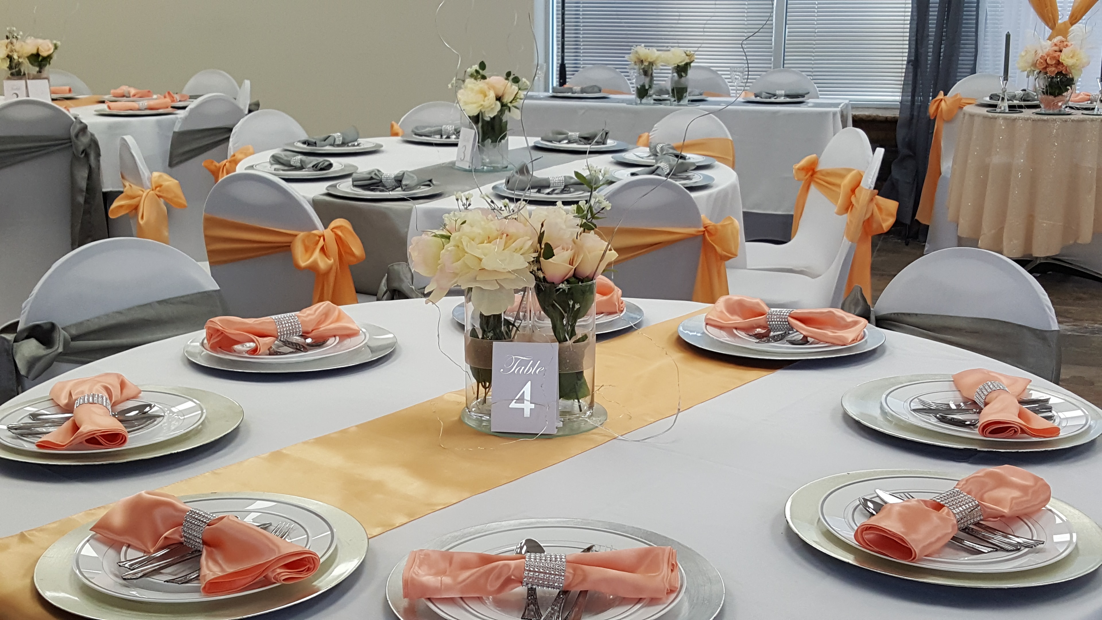 Peach floral table detail with gold accents at Deja Vu Event Space