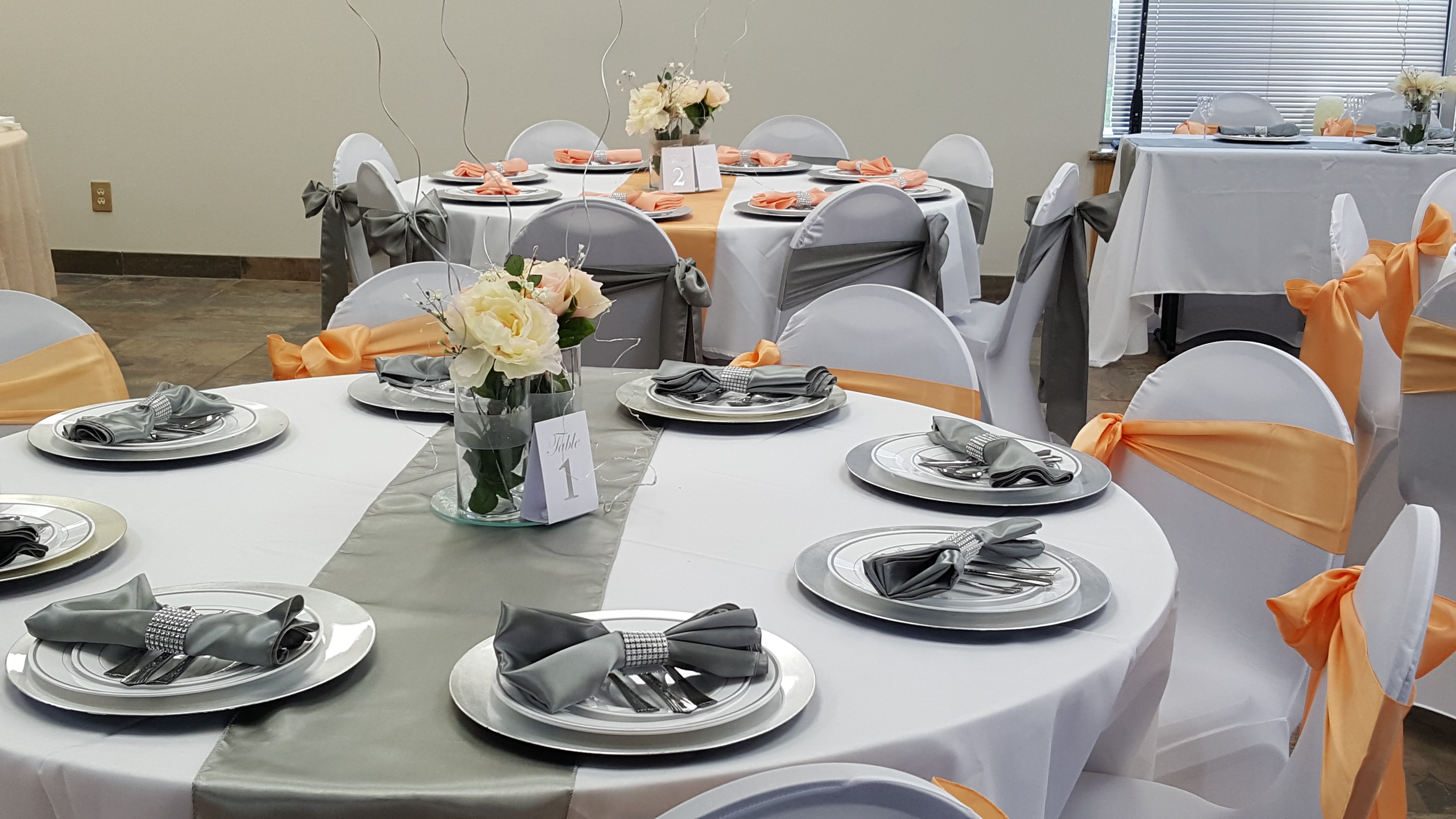 Formal peach and gray table setting at Deja Vu Event Space